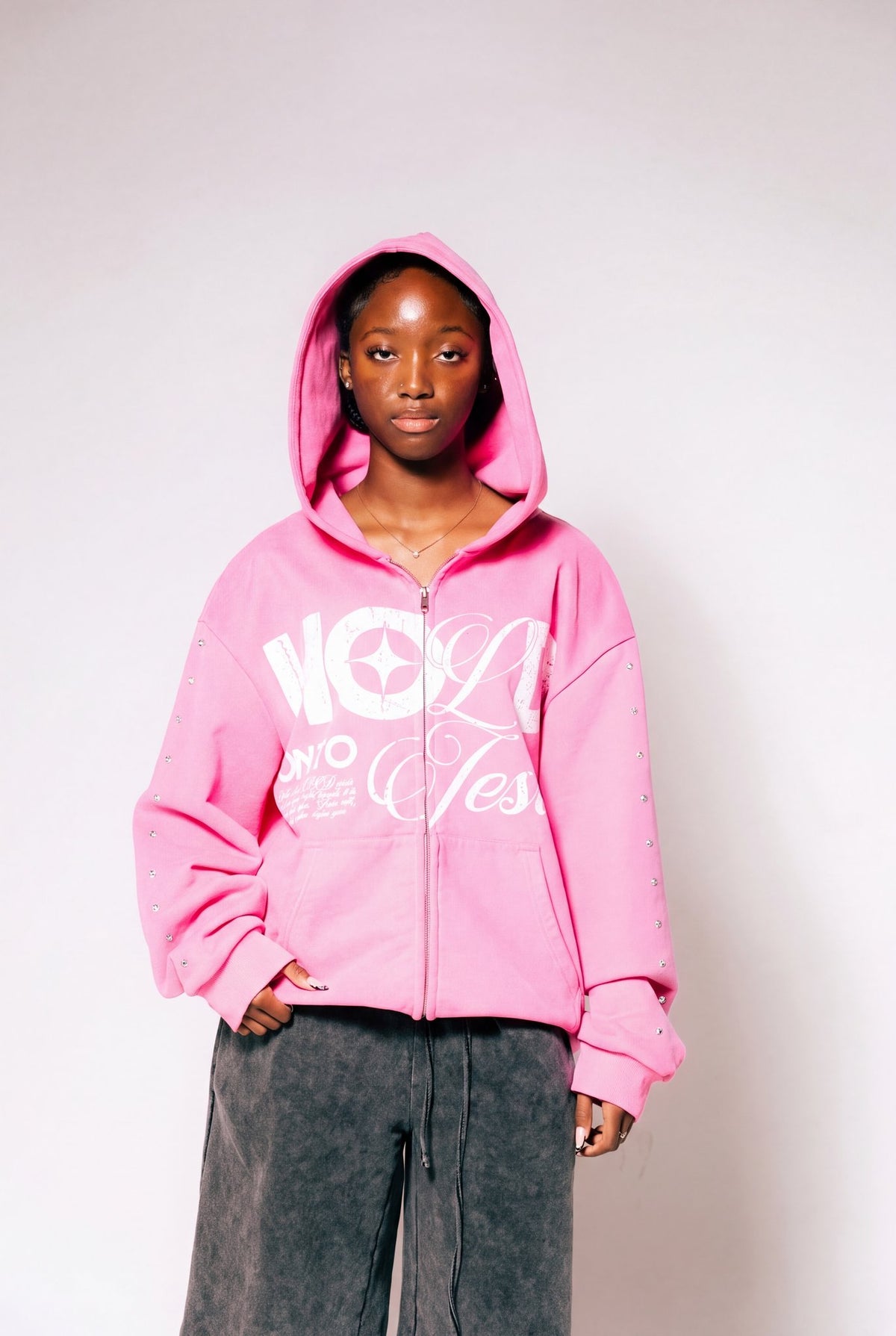 Hold On To Jesus Zip-Up Hoodie in pink, second model, front view