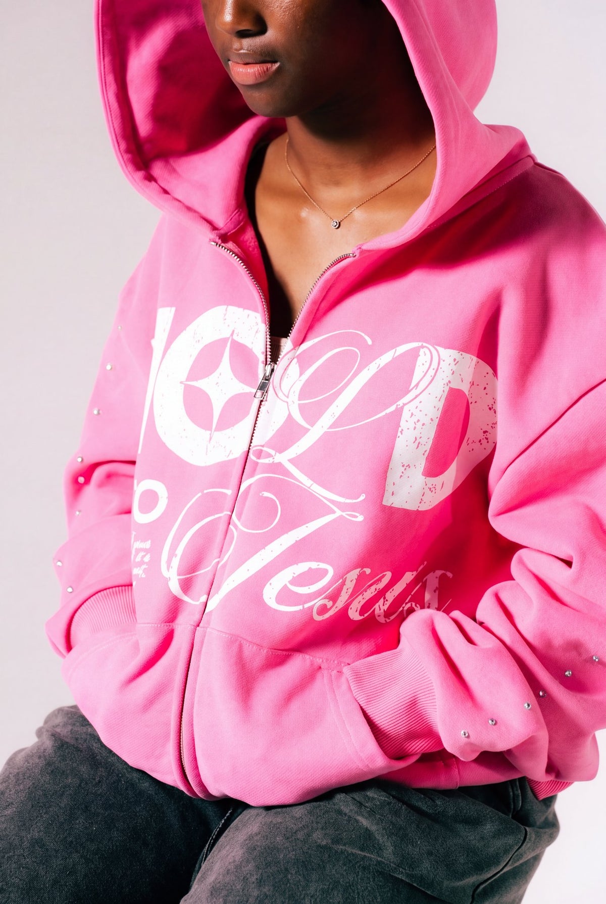 Hold On To Jesus Zip-Up Hoodie in pink, print and sleeve rhinestone close-up